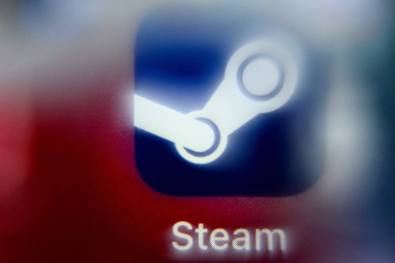 A imagem mostra um ícone do Steam, que é uma plataforma de distribuição digital de jogos. O ícone é predominantemente azul com um símbolo que representa uma roda dentada ou um mecanismo, acompanhado do nome