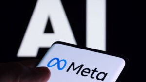 Logo da Meta em um smartphone com os dizeres "AI" ao fundo, desfocado